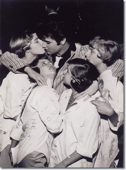 Elvis Presley with fans.