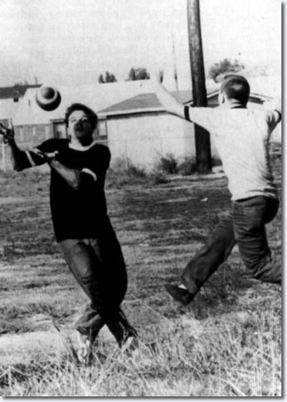 Elvis plays football, 1960s.