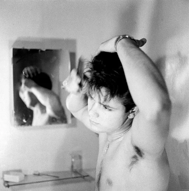 Cliff Richard tries to perfect his Elvis hairdo, circa 1959. Photograph: Beverly Lebarrow/Redferns